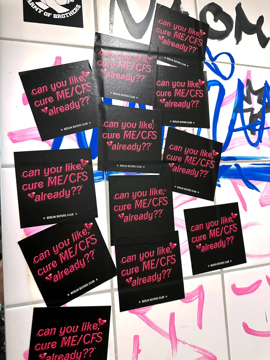 Black stickers asking Can you like, cure ME/CFS already?? stuck on a tiled wall